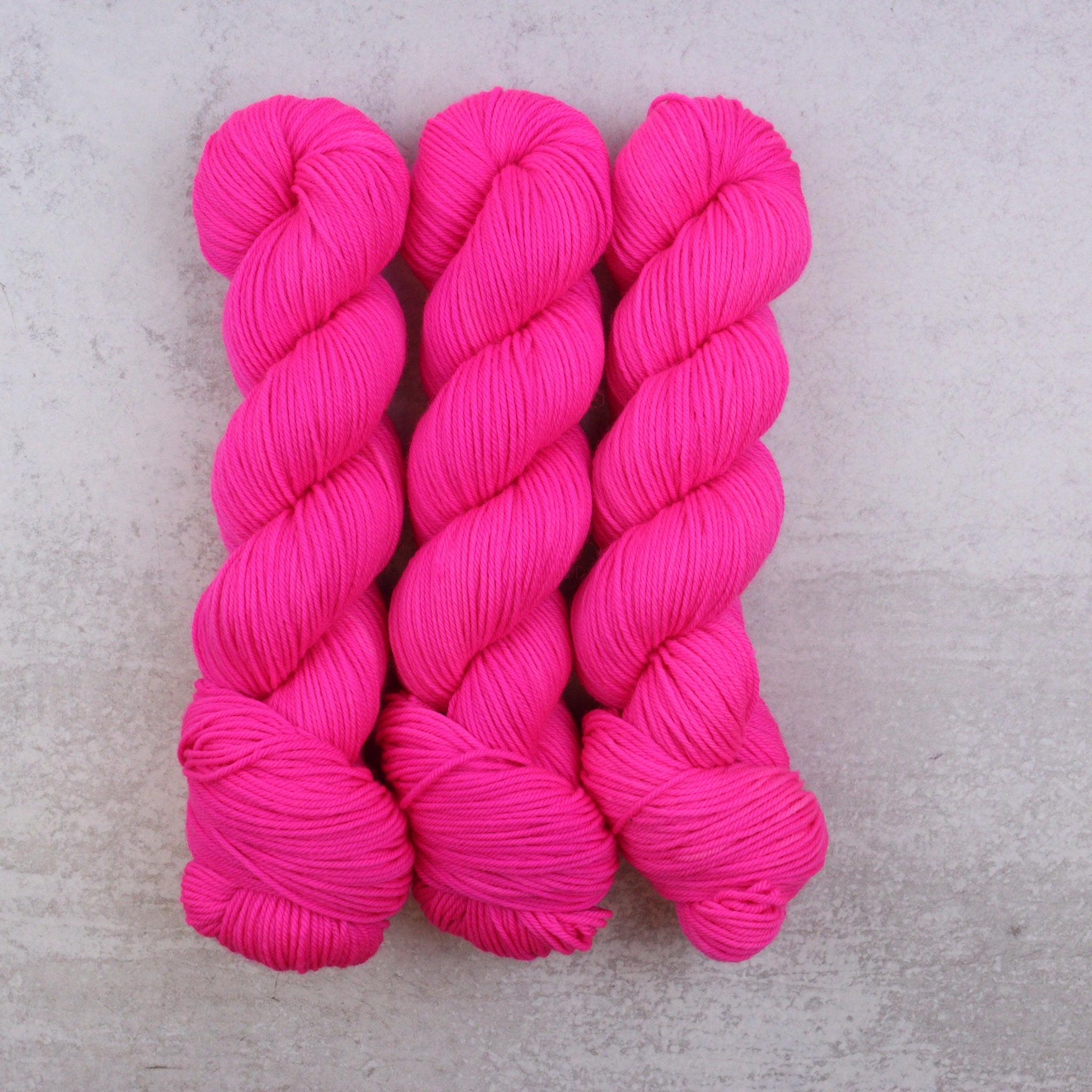 Neon Pink Hand-Dyed Superwash Merino DK Yarn | Spun Right Round