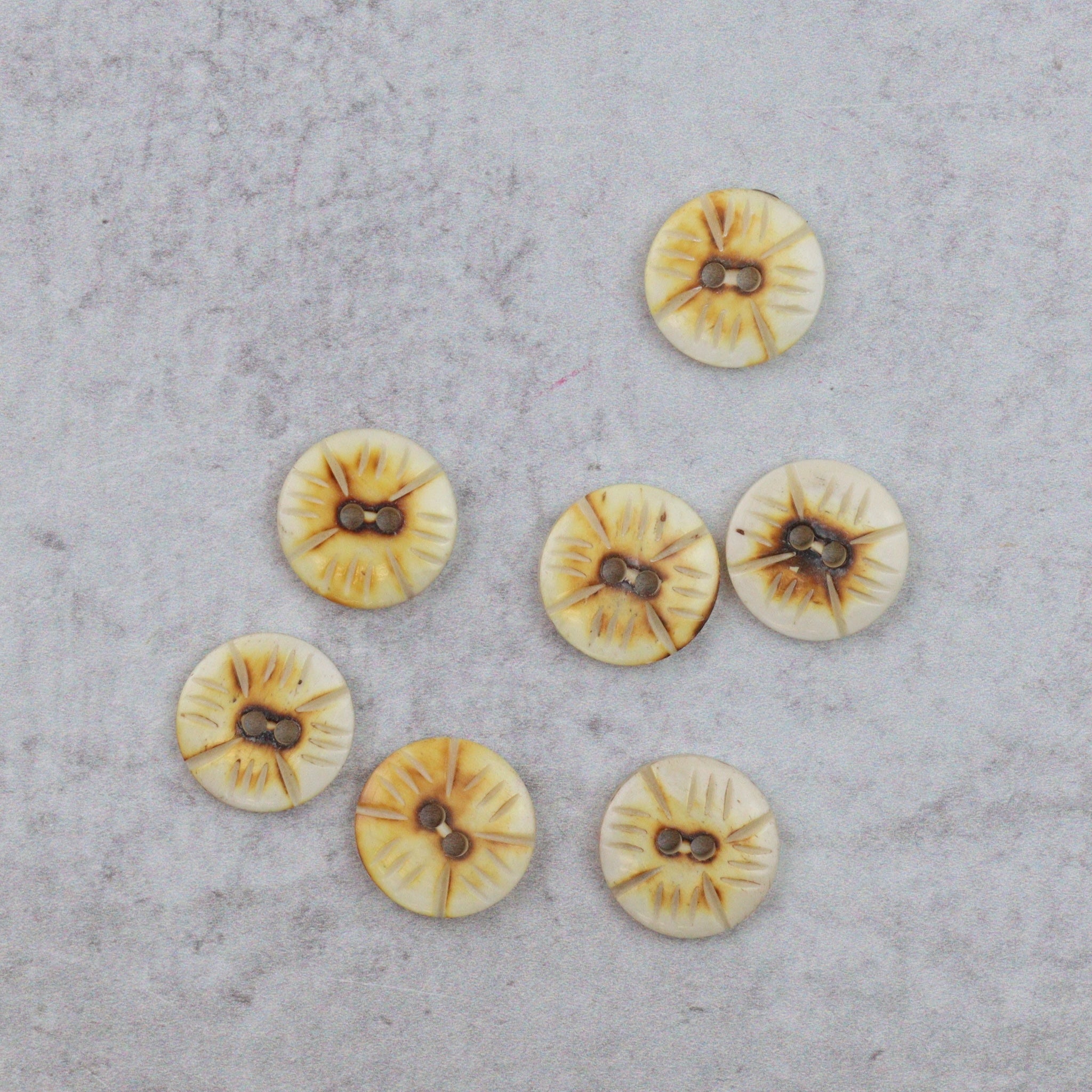 Burned and Notched Buttons